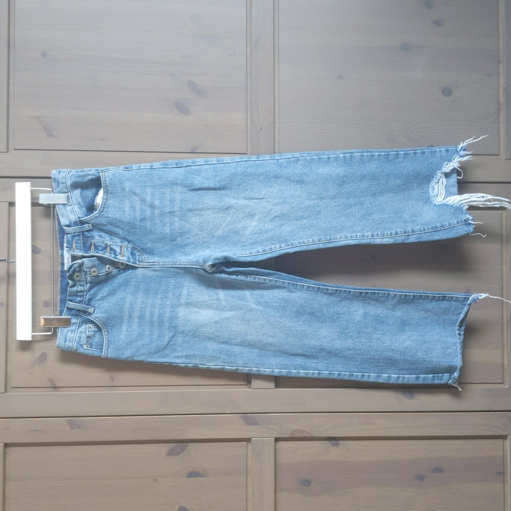 Distressed wider leg cropped-style jeans